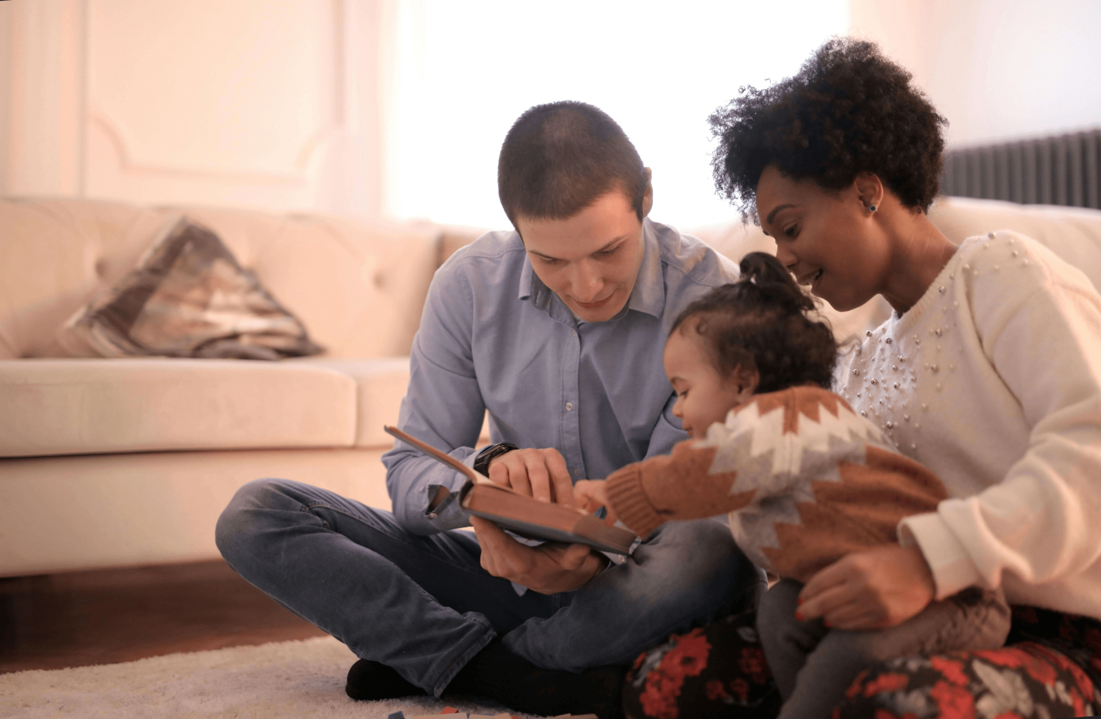 Happy biracial family smiling in a cozy home